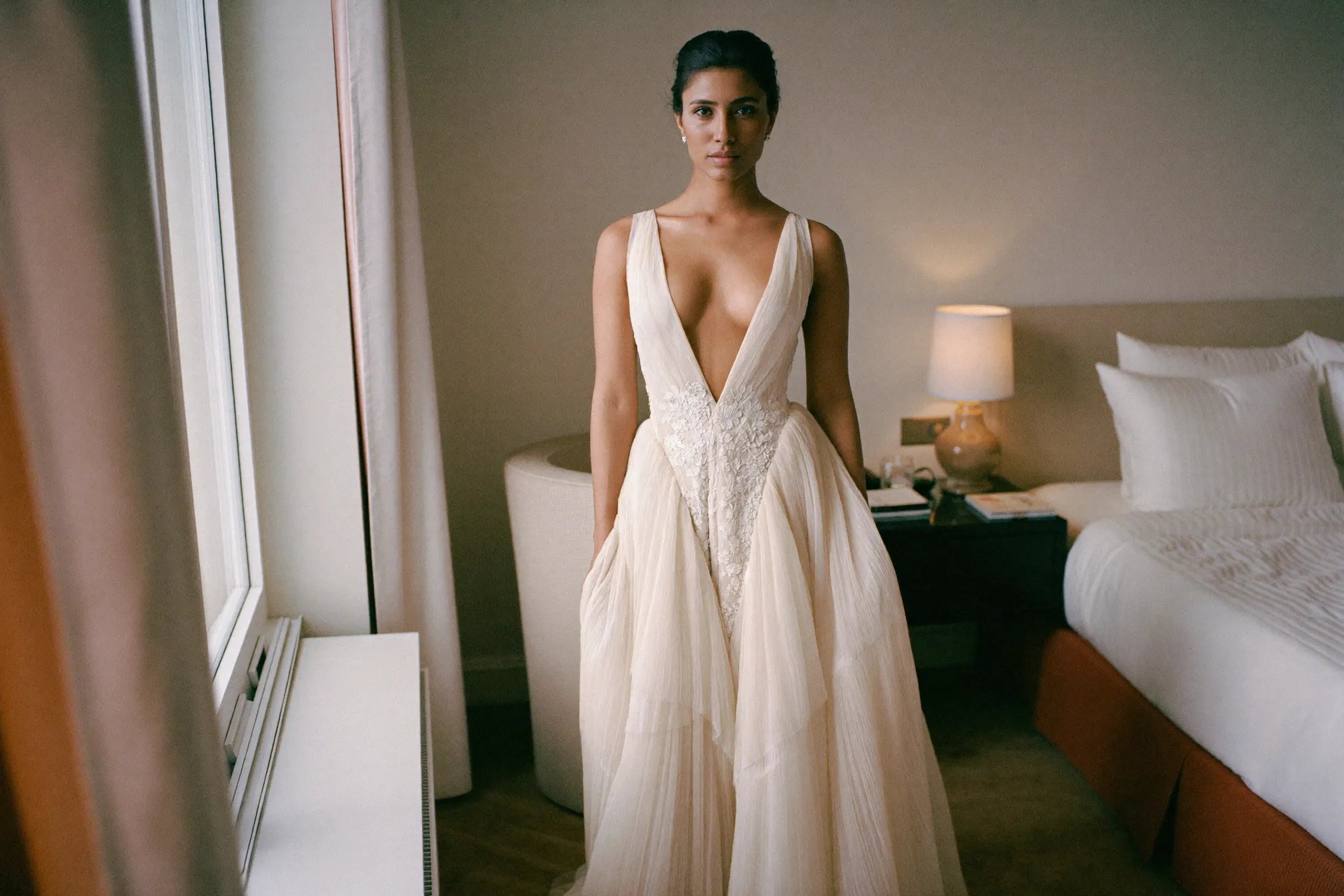 Bride in a plunging V-neck wedding gown