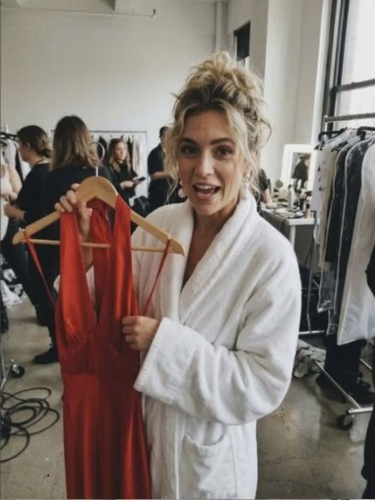 ciralu-seen-backstage: red backless dress on a hanger